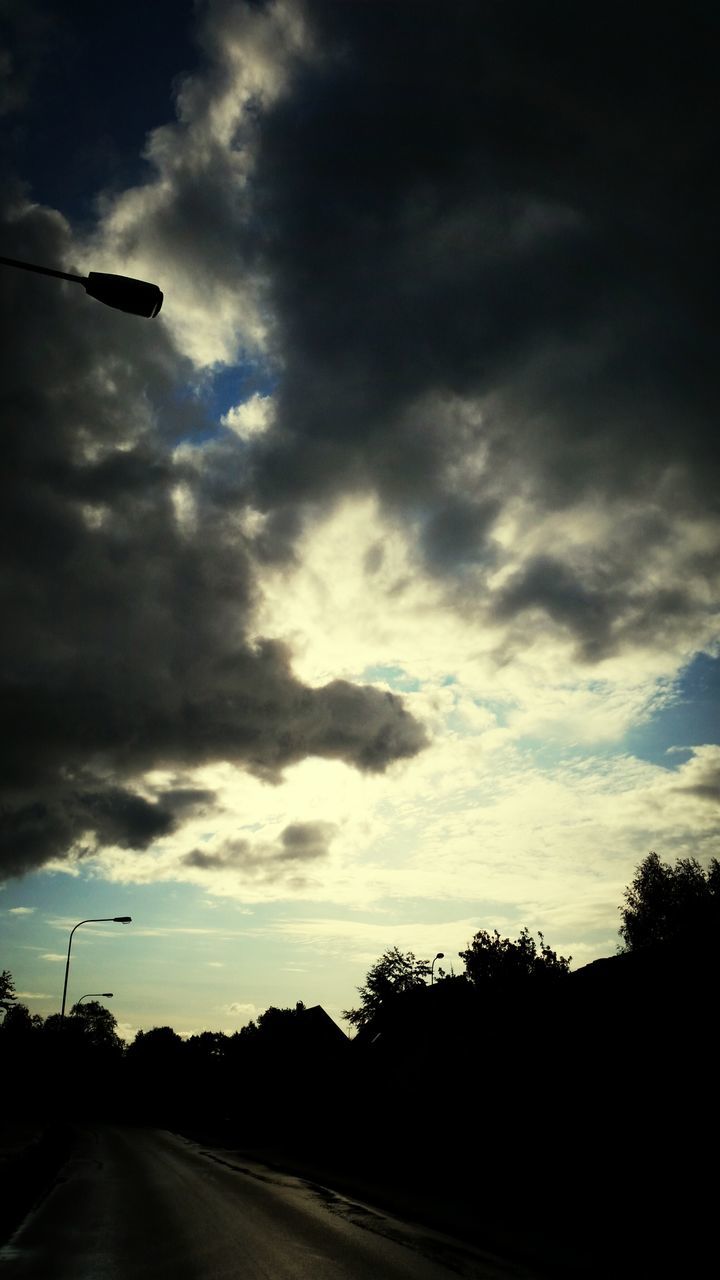 sky, transportation, cloud - sky, the way forward, road, cloudy, silhouette, cloud, diminishing perspective, road marking, vanishing point, tree, dusk, street, sunset, mode of transport, nature, car, overcast, street light