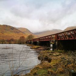 Bridge over river against sky