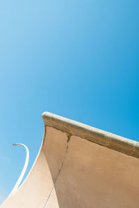 Low angle view of building against clear blue sky