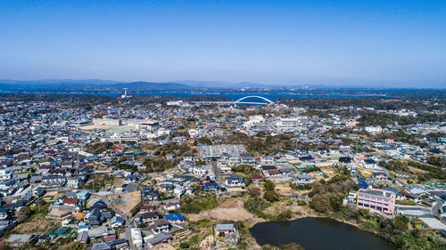 High angle view of townscape against blue sky