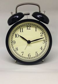 Close-up of clock on table