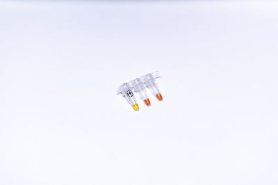 Close-up of clock over white background