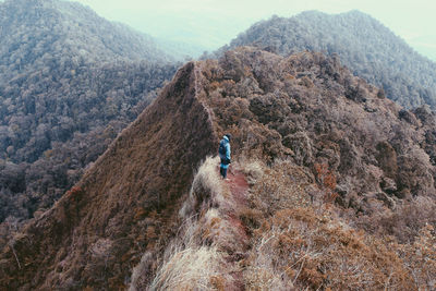 High angle view of man standing on mountain