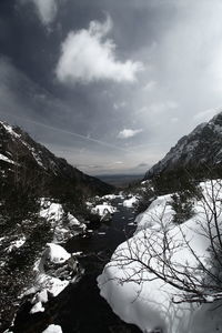 Scenic view of mountains against sky during winter