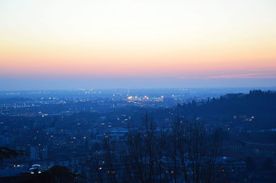 Cityscape against sky during sunset