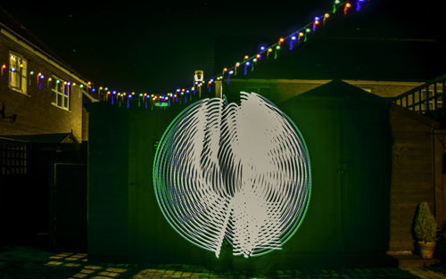 Illuminated lighting equipment hanging at night