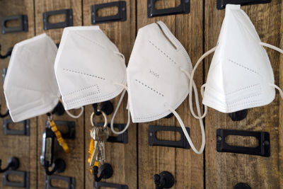 High angle view of paper hanging on table at home