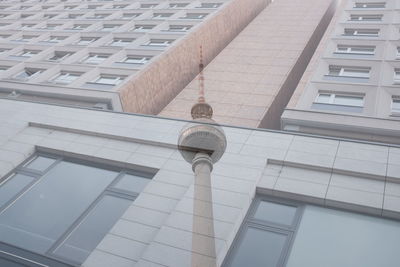 Digital composite image of fernsehturm tower and building