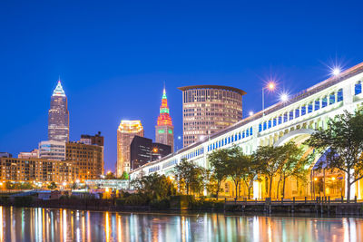 Reflection of buildings in city at night