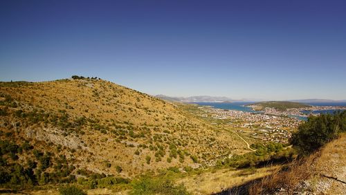 Scenic view of landscape against clear blue sky