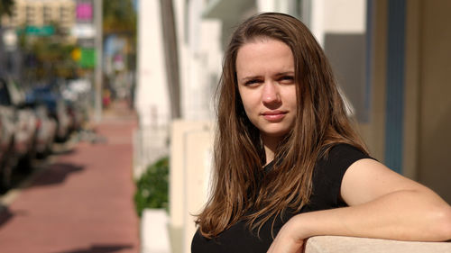 Portrait of young woman looking away