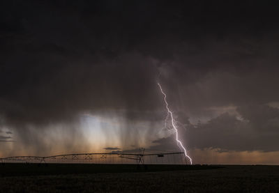 Low angle view of lightning at dusk