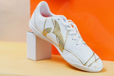 Close-up of shoes on hardwood floor