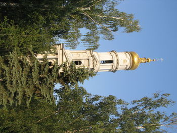 Low angle view of statue against sky