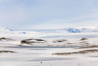 Scenic view of sea against sky during winter