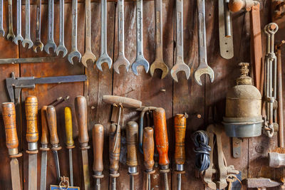 Directly above shot of various work tools on table at workshop