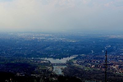 Aerial view of cityscape against sky