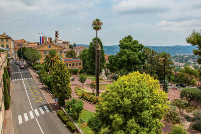 Landscaped square with buildings and street at the city center of grasse, in the french provence.