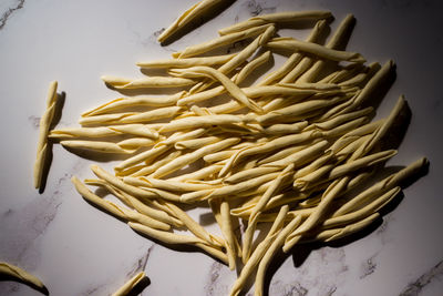 High angle view of vegetables on table against white background