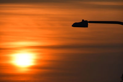 Scenic view of sea against orange sky