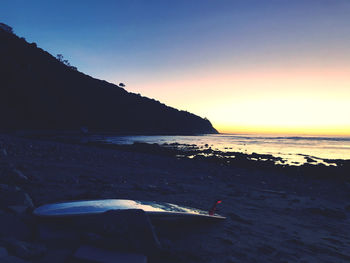 Scenic view of sea against clear sky during sunset