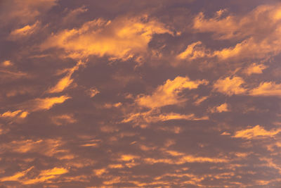 Low angle view of dramatic sky during sunset