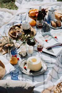 High angle view of food with decorations and books on table