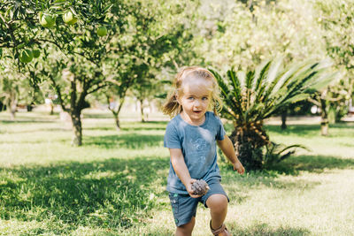 Portrait of cute girl in field