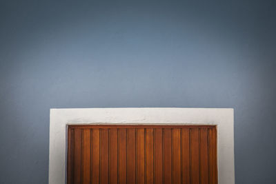 Close-up of white house against wall