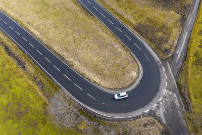 High angle view of road by street in field