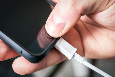 Close-up of person holding mobile phone