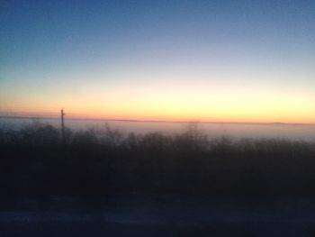 Scenic view of sea against sky at sunset