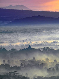 Scenic view of landscape against sky during sunset