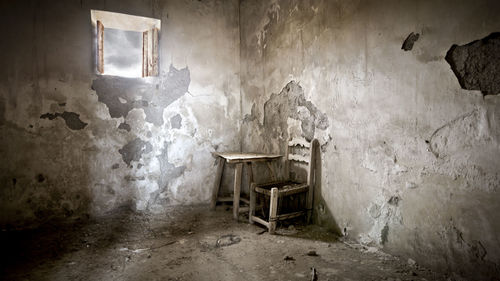 Damaged chair in abandoned house