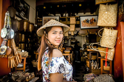 Portrait of smiling young woman in shop