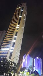 Low angle view of modern building at night
