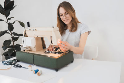 Portrait of woman working on table