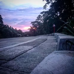 Empty road at sunset