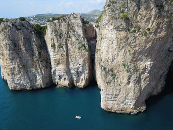 Panoramic view of rock formation in sea