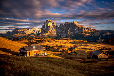 Sassolungo mountain group above alpe di siusi in val gardena, south tyrol, italy in autumn.