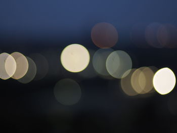 Defocused image of illuminated lights at night