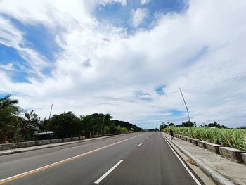 Empty road against sky