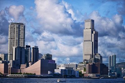 Modern buildings against sky in city