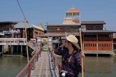 Woman standing on pier 