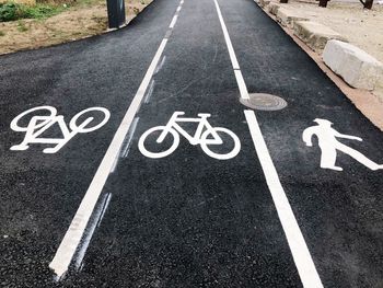 High angle view of arrow symbol on road