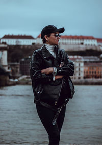 Full length of man standing by canal