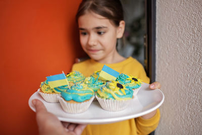 Portrait of smiling girl eating food