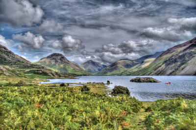 Scenic view of lake by mountains