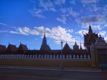 Silhouette of temple against blue sky