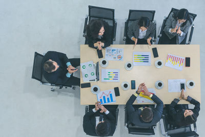 High angle view of business people discussing in office